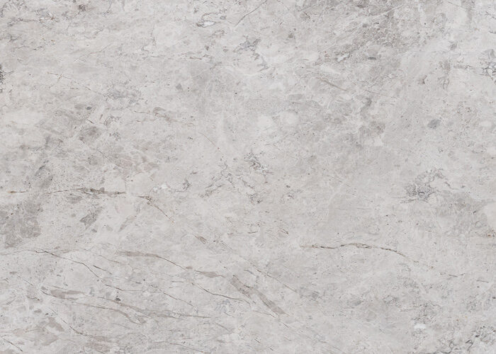 a beautiful cool grey marble. New Tundra is a bright sort of Tundra Grey family. A warm and attractive marble with white veins in a mid grey background that form cloudy patterns. Supplied by Atlas Tile and Stone.