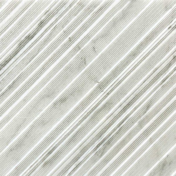 A high end textured natural stone marble tile. Chevron is a popular luxury texture in home design and décor. Decorative tile supplier; Atlas Tile and Stone.