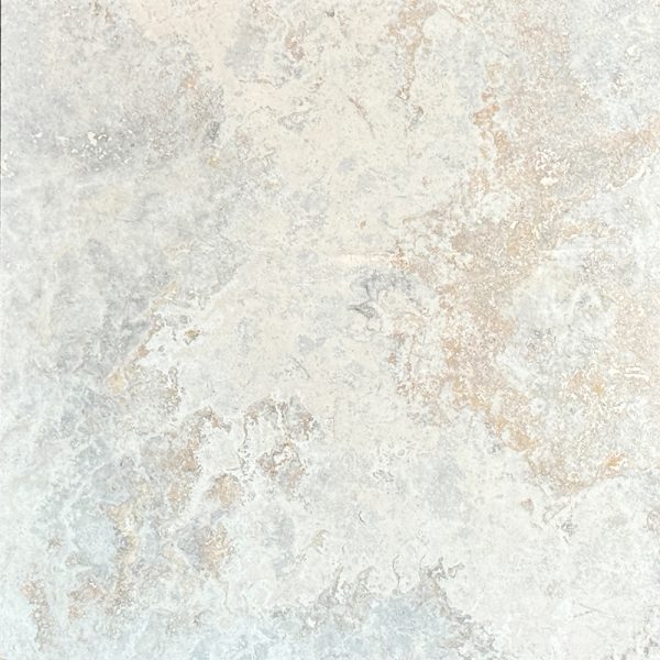 A wonderful natural cross cut silver travertine tile with a combination of cream, grey and orange colours. Silver travertine supplier; Atlas Tile and Stone.